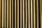 Vertical golden oak panels in wall cladding