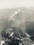 Vertical grayscale shot of the Cascades mountain range over Washington, US on a sunny day