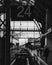 Vertical grayscale shot of the number 24 on a banner at the train station
