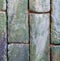 Vertical greenish brick wall for texture and background