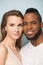 Vertical head shot smiling African American man and Caucasian woman