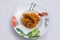 Vertical Hero shot of chicken curry with pasta noodles in a plate with minimal white background with 60 degree angle from
