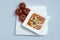 Vertical Hero Shot of a Tomato Soup with bread crumbs, oregano on a minimal white background with a diagonal 45 angle