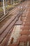 Vertical high angle closeup shot of graded stones on the rails of a train