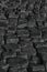 Vertical high angle greyscale shot of dark cobblestone ground