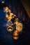 Vertical high angle shot of elegant candle jars on the stairs under the wall