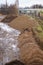 Vertical high angle shot of piles of sand in an area of construction