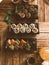 Vertical high angle shot of small sushi sets on a wooden table