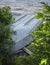 Vertical high angle shot of an upside-down rowboat on a dock