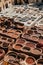 Vertical high-angle view of the traditional tannery vats on a sunny day in Fes