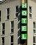 Vertical Hotel signboard over the entrance to the building.