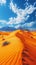 vertical illustration of sand dune desert landscape in front and mountains in background with blue cloudy sky