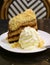 Vertical Image of Banoffee Pie Cake Served with Fluffy Whipped Cream