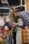 Vertical image of bearded father giving candy to his son