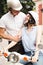 Vertical image of cheerful young couple in crash helmets posing