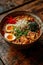 vertical image of closeup bowl of delicious ramen on a wooden table, tasty traditional asian noodle soup