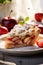 vertical image closeup of a piece of tasty homemade sweet apple pie on light kitchen background