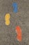 Vertical image of colorful footsteps leading one in a positive direction