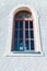 Vertical image of a domed window on old catholic chapel