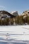 Vertical image of the frozen alpine Emerald Lake at Rocky Mountain National Park in Colorado, USA