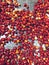 Vertical image a heap of harvested red, orange and white peppers