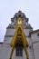 Vertical Image of Leeds Civic Hall underneath a bright golden clock