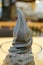 Vertical Image of a mouthwatering bamboo charcoal soft serve ice cream in a glass