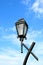 Vertical image of retro style streetlamp on vibrant blue sky