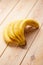 Vertical Image of ripe Banana cluster on wooden table