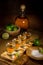 Vertical image of a serving of gold Tequila shots spread out and ready to drink at a party