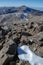 Vertical image from the top of Mulhacen with a little snow in the foreground, the Caldera lagoon, Loma Pela and in the background