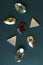 Vertical image.Top view of decorative gemstones on the dark green surface.Decor for clothing