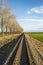 Vertical image of train tracks taken from the caboose speeding through southern Bulgaria