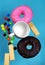 Vertical images of donuts and pastries colorful, pastel blue background. Sweet and snack ideas