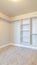 Vertical Interior of walk in closet with bare shelving