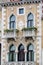 Vertical: Intricate art and sculptures adorn the historic buildings in Venice, Italy.