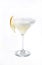 Vertical isolated shot of a glass of margarita with a lemon slice  - perfect for menu usage