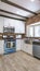 Vertical Kitchen with brick backsplash and counter spcae