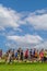 Vertical landscape of a group of joggers at a Parkrun event with copy space above