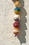 Vertical line of colored buoys on tropical shop wall