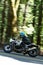 Vertical long exposure of a motorcyclist passing by on a BMW R9T Cafe Racer