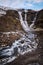 Vertical long exposure shot of the Rjukandi Waterfall in Iceland