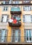 Vertical low angle shot of the facade of a yellow suburban residential building