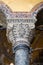 Vertical low angle shot of an old building marble column with beautiful patterns