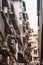 Vertical low angle shot of old dirty slum resident and old town streets in Macao