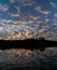 Vertical mesmerizing view of a cloudy sky reflecting in the sea at sunset  in Brazil