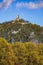 Vertical of modern building on top of a green Drachenfels mountain in Konigswinter,Germany in autumn