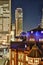 Vertical modern cityscape building bird eye aerial night view of Tokyo Station under neon light and dark blue sky in Tokyo, Japan