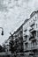 Vertical monochrome shot of the beautiful cityscape of Berlin with buildings and cars in Germany