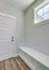 Vertical Mudroom interior with a seating area with shoe storage at the bottom